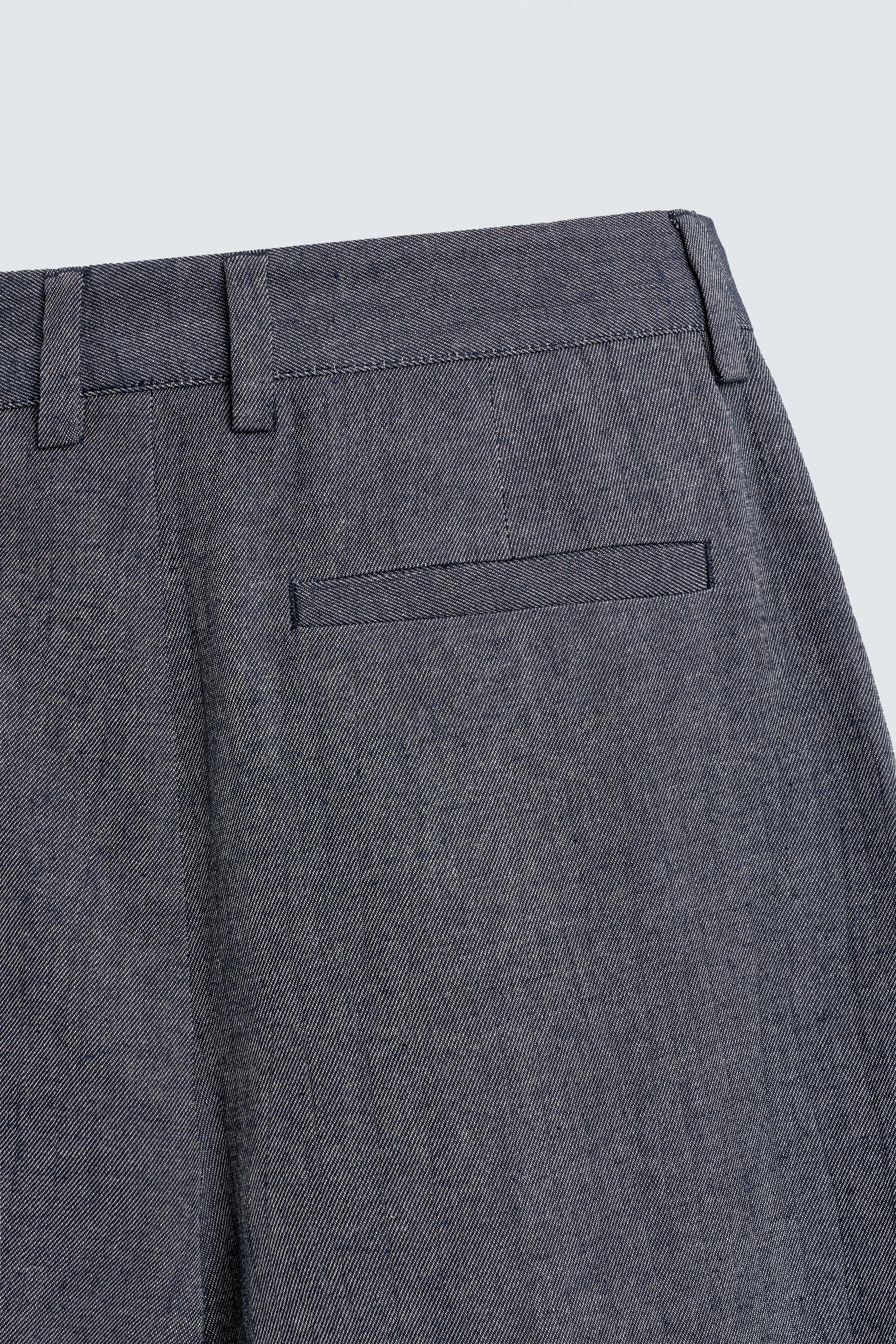 PLEATED RELAXED FIT PANTS